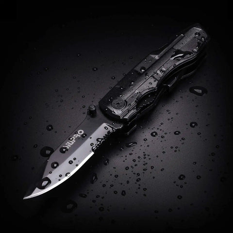 Everyday Carry Multitool For Men With Folding Knife And Pliers, Tactical Folding Tool Set in black with water droplets on blade