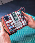 Raspberry Pi Pico W Starter Kit With 12 Detachable Sensors And A 234 Page Learning Guide For Beginners Learn To Code Hands On DIY Electronics Kit For Fun Prototyping handheld red kit with Pico W, sensors, and OLED screen