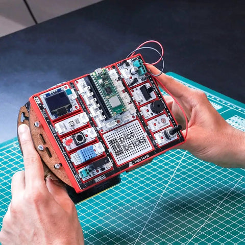 Raspberry Pi Pico W Starter Kit With 12 Detachable Sensors And A 234 Page Learning Guide For Beginners Learn To Code Hands On DIY Electronics Kit For Fun Prototyping handheld red kit with Pico W, sensors, and OLED screen