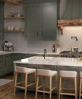 Modern kitchen with hansgrohe Talis N Pull Down Kitchen Faucet, 1-Handle in Matte Black, showcasing elegant design and marble countertops.