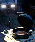 14,000 Lumen LED Work Light With All Metal 60 Inch Telescoping Tripod Stand illuminating outdoor grill scene