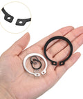 Hand holding 210 Piece External Retaining Ring Set In 14 Sizes For Valves And Electrical Appliances, 65Mn Carbon Steel Circlip Snap Rings Assortment Kit For Round Wire Retaining Rings.