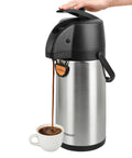 Hand pressing lever of Pump Action Airpot Coffee Dispenser 3L Stainless Steel Thermal Carafe, serving coffee into cup.