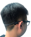 Side view of a child wearing black Kids Silicone Glasses Straps 3 Pack Non Slip Elastic Eyewear Straps For Boys And Girls Sunglasses Holder