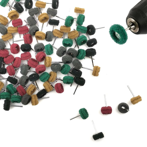 Front view of 100 felt buffing wheels on metal shanks; assorted colors, with one wheel mounted on a drill chuck.
