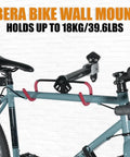 Space Saving Wall Mounted Bike Holder With Adjustable Frame Arm And Soft Rubber Cradles holding a bike on a white wall