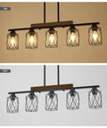 The Real Deal Five Light Farmhouse Chandelier With Slick Vintage Iron Frame And Crisp Clear Shades Giving Off Clean Modern Industrial Lighting Vibe For Dining Room Table Centerpiece, illuminated view.