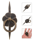 Close-up of vintage U shaped drop ring cabinet handle showing iron design with clover detail, part of a set of 10.