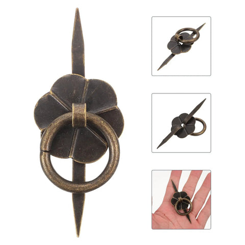 Close-up of vintage U shaped drop ring cabinet handle showing iron design with clover detail, part of a set of 10.