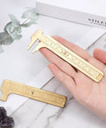 Hand holding Brass Pocket Vernier Caliper Set with 3.15 Inch and 3.94 Inch mini sliding calipers for jewelry measurement tool.