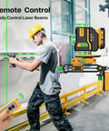 360 Self Leveling Laser Level With Green Beam 4x360 Bright Lines For Construction Pro Grade Kit With Rechargeable 12V Battery Up To 40 Hours Remote Control Magnetic Rotating Stand And Hard Carry Case, worker using remote
