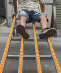 Person seated on Ace Of The Dock Portable Gravity Conveyor Belt 16 Inch Wide 4 Foot Foldable Frame.