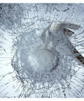 Shattered effect on glass illustrating the Window Film Security And Safety 8 Mil Clear 24 Inch By 49 Foot For Interior Install Protects Against Break Ins And Shattered Glass Meets ANSI Z97 1 Class B And CPSC Category 1 Standards.