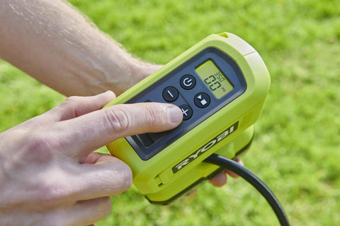 Hand operating 18V One Plus Cordless Tire And Ball Inflator With Mini Compressor 11 Bar Max Fast Inflation To 32 PSI In Under A Minute Includes 3 Tips