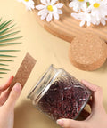 Person sealing a jar with a Tapered Cork Stoppers Set, Large 3.5 Inch Wood Cork Bottle Plugs For Canning Jars And Wine Bottles