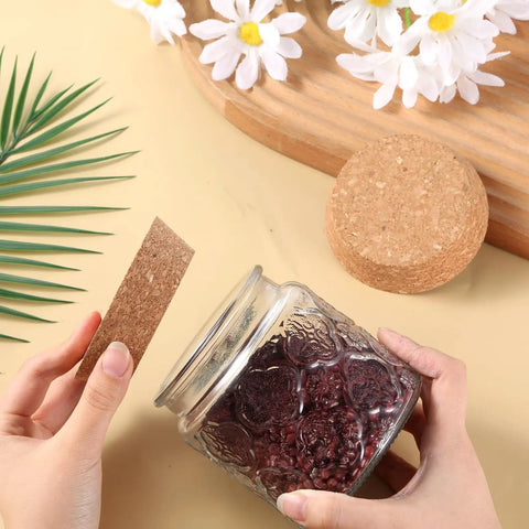 Person sealing a jar with a Tapered Cork Stoppers Set, Large 3.5 Inch Wood Cork Bottle Plugs For Canning Jars And Wine Bottles
