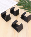 Creative Plastic Sectional Clips For Sofa And Furniture, durable black plastic clips on wooden surface