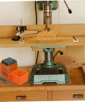 Drill press setup with an Awesome 37 Piece Metal Stamping Kit With Letters Numbers Heart Symbols And Punches for DIY crafting.