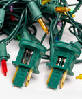 125V Glass Fuses Kit For Outdoor Christmas Lights And Fans, 100 Piece Replacement Set, close-up of fuses in plugs
