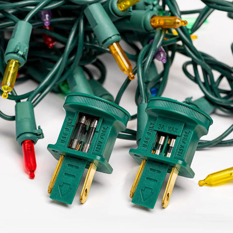 125V Glass Fuses Kit For Outdoor Christmas Lights And Fans, 100 Piece Replacement Set, close-up of fuses in plugs