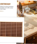Totally Game Changing Wood Jewelry Tray With Plush Suede Grid Organization Board featuring a 40-slot design on a desk.