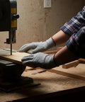 Person wearing 20 Pairs Cut Resistant Gloves Level 5 Protection For Kitchen Shucking Fish Meat And Wood Carving With No Slip Grip Comfortable Fit Anti Cut Pro Gloves For DIY Crafts And Heavy Duty Cooking while using a bandsaw in a woodworking shop.