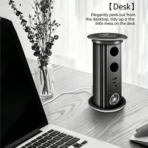 Auto Rises Pop Up Outlet Slick Aluminum Desk Power Strip With Swappable Modules Quick Charge Ports And Optional Speaker Zero Clutter Vibe Ideal For Kitchen Islands Or Office Desks Looking Sharp, showcasing a black aluminum power strip on a desk.