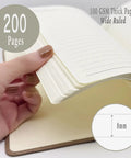 Hand flipping pages of Engineering Nerd Gift Journal For Students And Pros, A5 Lined Notebook With Pen, 200 Pages.