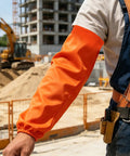 No Sweat Flame Resistant Welding Sleeves With Adjustable Cotton Fit shielding mechanics from sparks, vivid orange color, outdoor construction site.