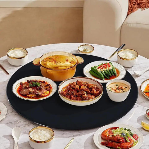 Smooth As Butter Black Tempered Glass Lazy Susan Turntable Built Different Heavy Duty Rotating Serving Tray For Dining Tables with assorted dishes.