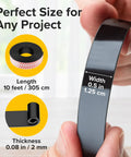 Close-up of Magnetic Tape With Adhesive Backing 10 Feet Long By Half Inch Wide, showing size dimensions and hand holding the tape