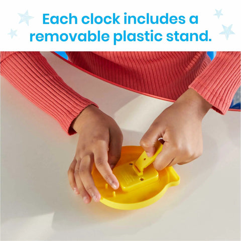 Child assembling yellow clock from Awesome Set Of Six Rainbow Geared Mini Learning Clocks For Kids To Practice Telling Time Hands On