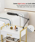 Salon Trolley Cart With Wheels For Estheticians, Mobile Beauty Cart With 1 Drawer And 2 Trays in white gold finish, with lamp.