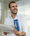 Smiling man holding newspaper and stainless tumbler from Six Piece Engineering Graduation Gift Set For Men