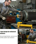 Hella Durable Hydraulic Gear Puller Set With Hand Pump 50 Ton in use for extracting a pulley from machinery.