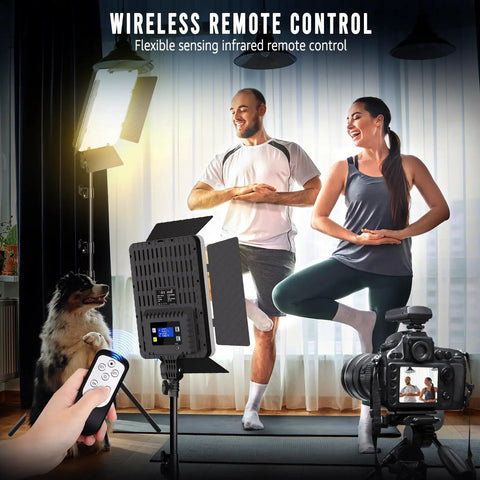 Couple practicing yoga with 2-Pack Pro-Grade Bi-Color LED Photography Lighting Kit, 36W Output, remote in hand, tripod, and camera.