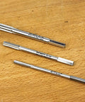 Three Piece Metric Wood Tap Set For Drill Pro Grade M6 X 1.0 M8 X 1.25 M10 X 1.5 High Speed Steel With Chrome Armor Plating displayed on table