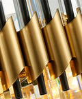 Close-up of sleek black and gold stainless steel ceiling pendant light showcasing detailed gold wave accent.