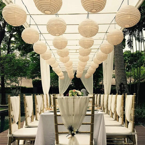 12 Pack White LED Paper Lanterns With Hanging Lights Includes 6 8 10 And 12 Inch Sizes Battery Powered LEDs Clear Fishing Line A Complete Grab And Go Decor Set For Weddings Birthday Parties Bridal Showers And Outdoor Use decor over outdoor dining setup