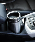 12V And 24V Car Kettle Heats Fast Stainless Steel Travel Mug For Sedans in vehicle cup holder next to gear console.