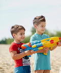 Toy water guns in bright blue and yellow held by three kids outdoors.