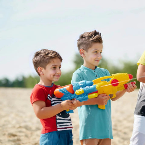 Toy water guns in bright blue and yellow held by three kids outdoors.