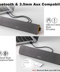 R50 Bluetooth PC Sound Bar For Desktop Monitor, USB Powered, 3.5mm Audio, Lit LED Lights, connected to a laptop.