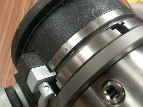 Close-up of Boss Tier 12 Inch Precision Horizontal Vertical Rotary Table With Slick Gear Drive chuck detail and vernier dial.