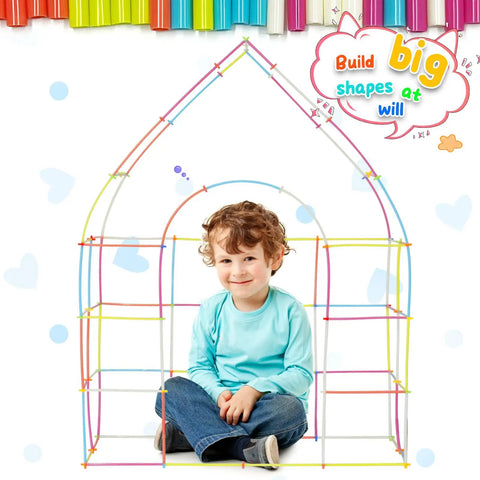 Child playing with Straw Constructor STEM Building Toy Kit With 600 Pcs Interlocking Gear Blocks, sitting inside colorful frame