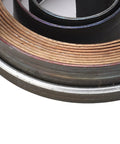 Close-up of the chrome plated steel spring coil from Beefy Bench Drill Press Quill Return Spring Kit Two Piece Set for maintenance.