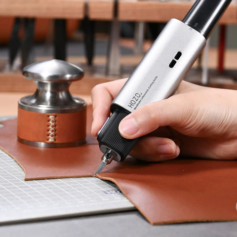 Cutting leather with Feather-Light Wireless On The Go Ultrasonic Cutter With 40kHz Vibration And 40W Auto Power, Replaceable Battery