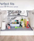 Under Sink Silicone Mat 28 By 22 Inch Waterproof Flexible Liner With Drain Hole Gray For Kitchen And Bathroom Cabinets Fits Most 30 Inch Cabinets Durable Spill Proof Protector No Fuss Cleanup placed under kitchen sink with cleaning supplies on top