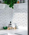 Self Adhesive 12x12 Backsplash Tiles 10 Pack For Kitchen Shower And Fireplace, installed on a white wall in a kitchen corner.