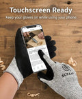 Wood Carving Gloves No Nonsense Hand Protection Heavy Duty Level 5 Cut Resistant gloves in use on smartphone screen on workshop table